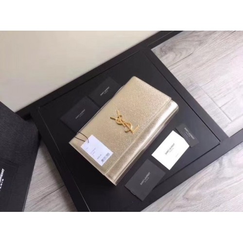 SAINT LAURENT Clutch de piel Cassandre 57312 oro